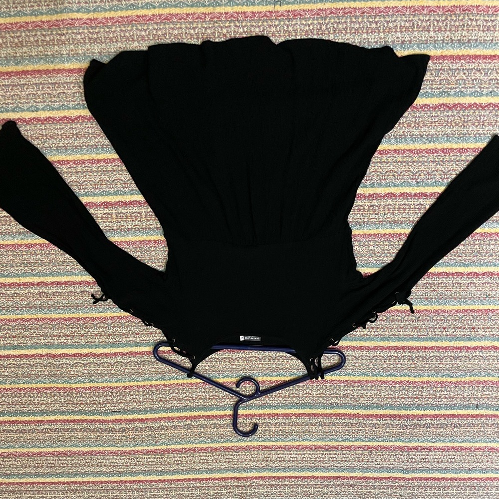 Flowy black top with lace up sleeves